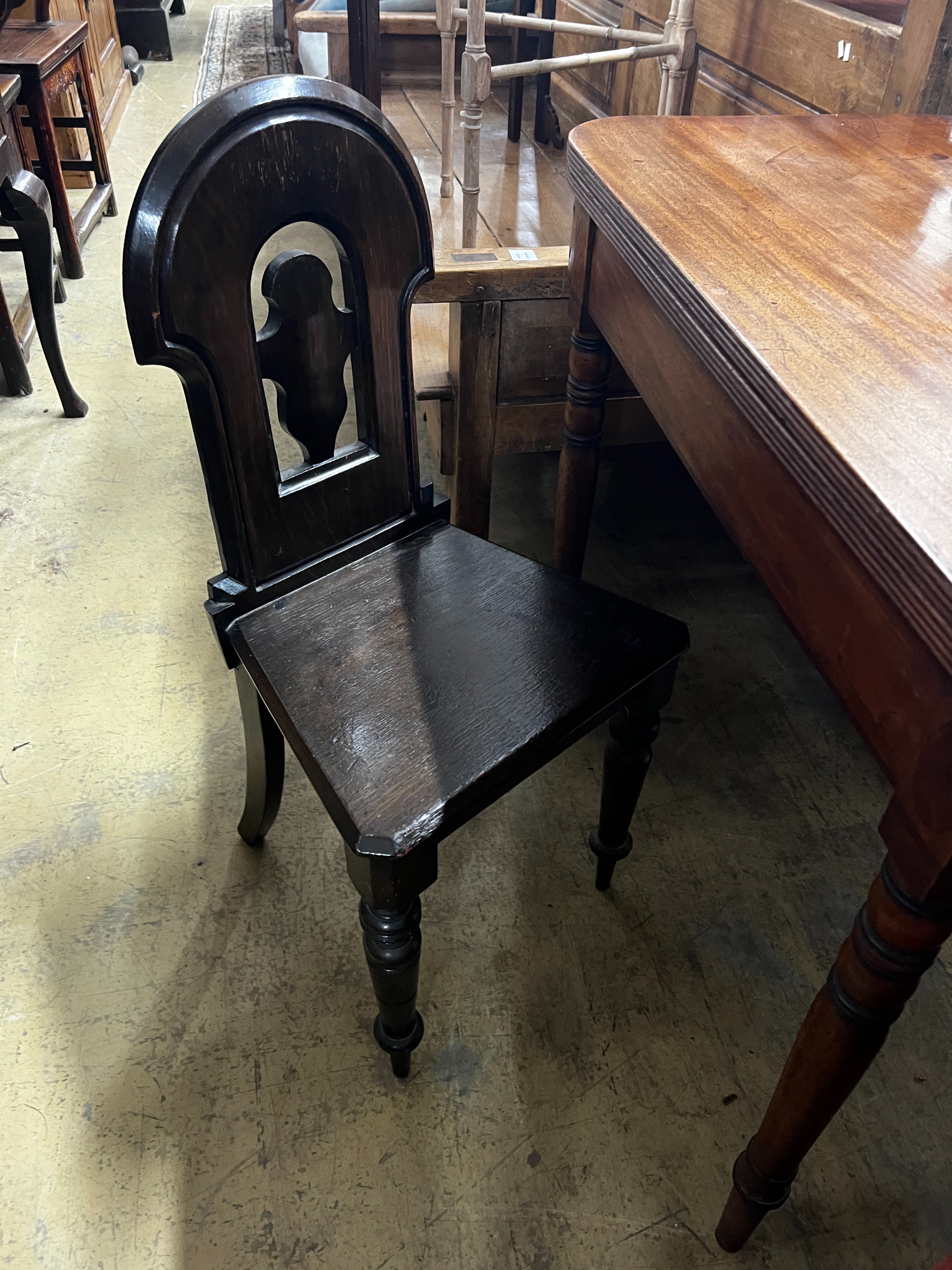 A Regency mahogany folding tea table, width 106cm, depth 52cm, height 77cm and a Victorian oak hall chair